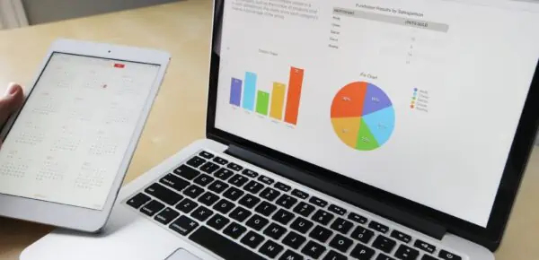financial metrics shown on laptop screen