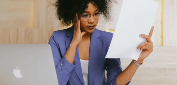 Woman In Blue Blazer Holding White Paper