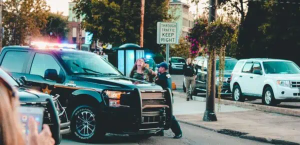 People Standing Beside Black Pickup Truck